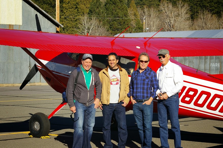 Close up of Jim Moore, Roger Hicks, Joe Bell and Caleb Dardick in front of the plane - Nov 2013